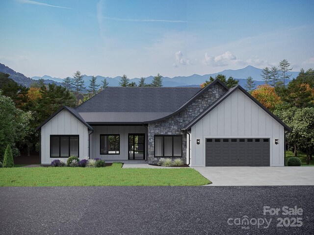 51 Bridgeway Dr Unit 12, Candler, NC 28715 - modern inspired farmhouse featuring a mountain view, an attached garage, board and batten siding, stone siding, and a front yard
