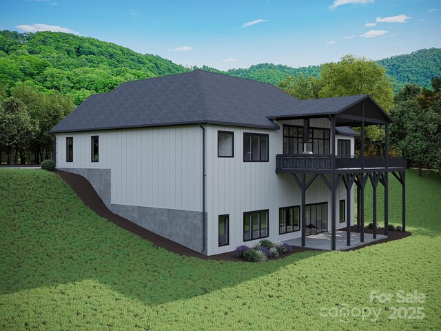 51 Bridgeway Dr Unit 12, Candler, NC 28715 - back of house with a patio area, a sunroom, a yard, and a forest view