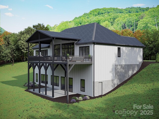51 Bridgeway Dr Unit 12, Candler, NC 28715 - rear view of house featuring a patio area, a shingled roof, a yard, a view of trees, and a wooden deck
