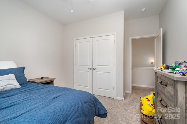 829 River Park Rd, Belmont, NC 28012 - bedroom with light carpet, a closet, and baseboards