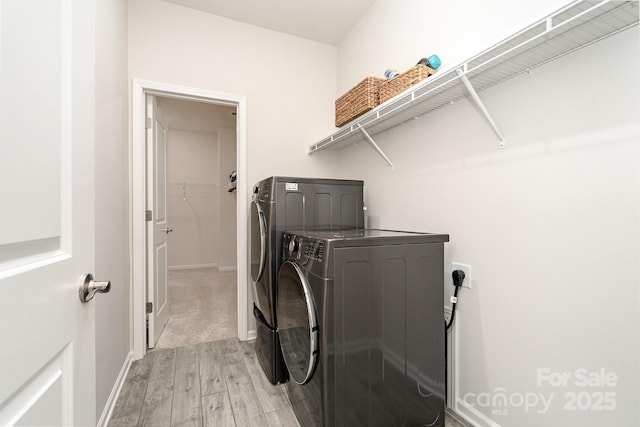 829 River Park Rd, Belmont, NC 28012 - laundry room with washer and dryer, light wood-style floors, and baseboards
