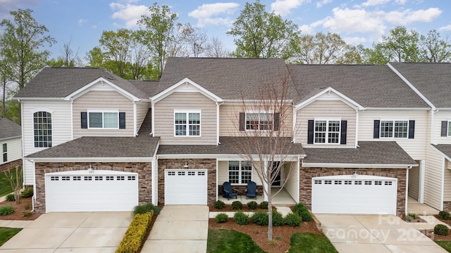 829 River Park Rd, Belmont, NC 28012 - view of property with stone siding, concrete driveway, and a shingled roof