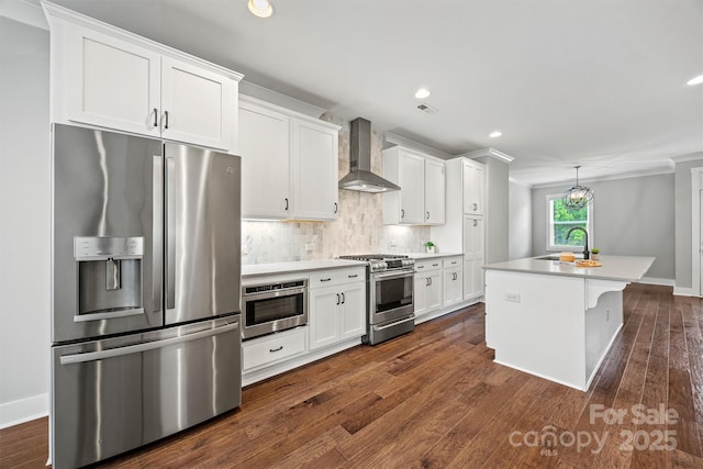 1162 E 36th St, Charlotte, NC 28205 - kitchen featuring appliances with stainless steel finishes, wall chimney exhaust hood, a sink, white cabinets, and dark wood-type flooring