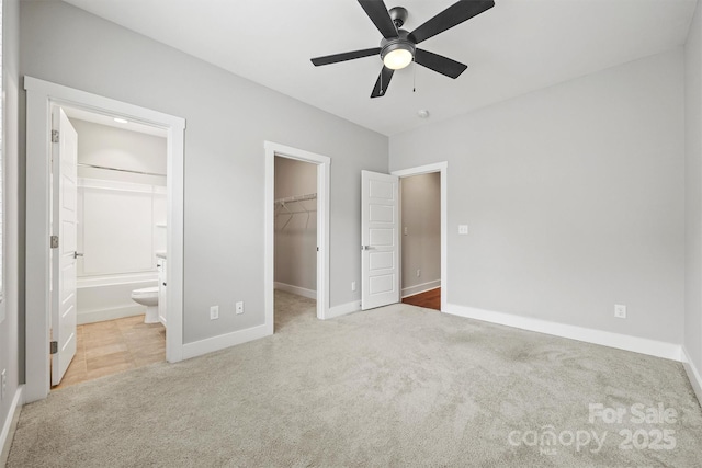 1162 E 36th St, Charlotte, NC 28205 - unfurnished bedroom featuring a spacious closet, carpet, baseboards, a closet, and ensuite bathroom
