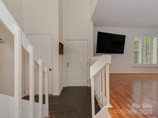 4025 Woodfox Dr, Charlotte, NC 28277 - hallway with dark wood-style flooring and baseboards