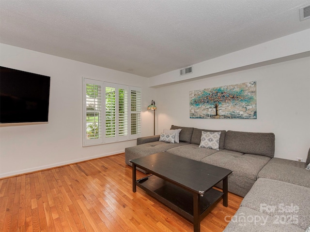 4025 Woodfox Dr, Charlotte, NC 28277 - living room featuring light wood finished floors and baseboards