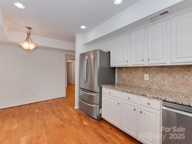 4025 Woodfox Dr, Charlotte, NC 28277 - kitchen featuring stainless steel appliances, backsplash, white cabinets, and recessed lighting