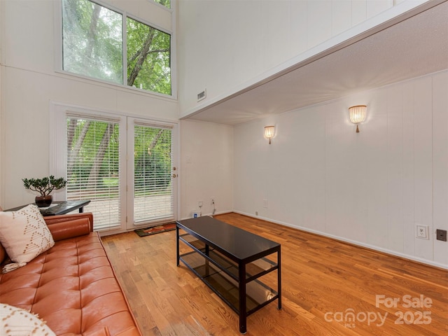 4025 Woodfox Dr, Charlotte, NC 28277 - living area with wood finished floors and a towering ceiling