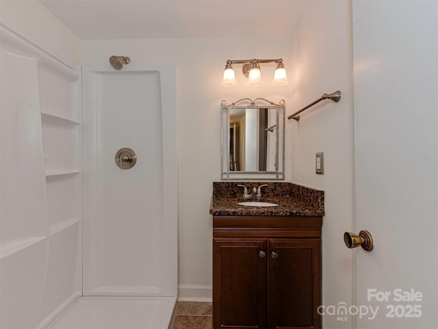 4025 Woodfox Dr, Charlotte, NC 28277 - full bath featuring a shower, vanity, baseboards, and tile patterned floors