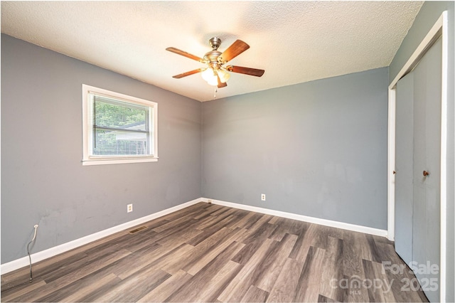 1094/1092 Curve View Rd, Lincolnton, NC 28092 - unfurnished room featuring wood finished floors, a ceiling fan, baseboards, and a textured ceiling