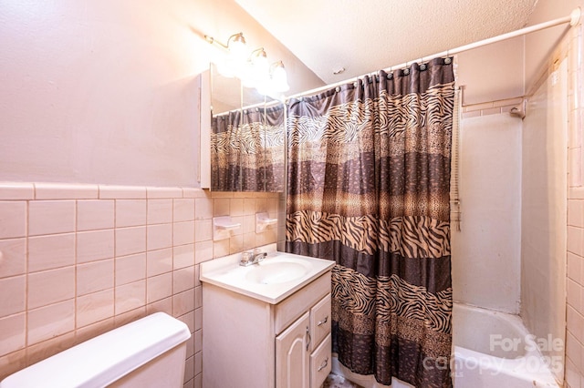 1094/1092 Curve View Rd, Lincolnton, NC 28092 - full bath featuring toilet, shower / tub combo with curtain, vanity, tile walls, and a wainscoted wall