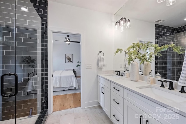 3163 Maury St, Charlotte, NC 28208 - bathroom with ensuite bathroom, a stall shower, double vanity, and baseboards