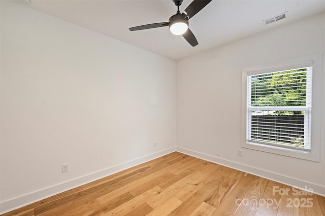 3163 Maury St, Charlotte, NC 28208 - spare room with light wood finished floors, baseboards, and a ceiling fan