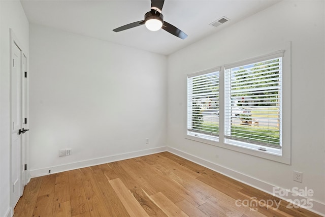3163 Maury St, Charlotte, NC 28208 - spare room with baseboards, light wood-type flooring, and ceiling fan