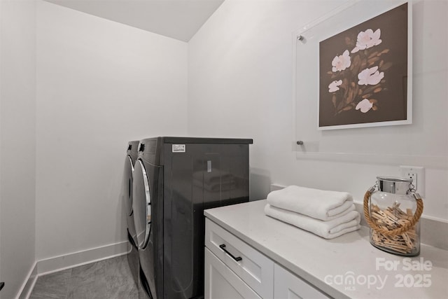 3163 Maury St, Charlotte, NC 28208 - washroom with cabinet space, washing machine and clothes dryer, marble finish flooring, and baseboards