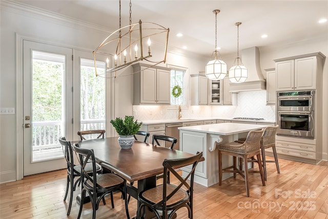 20 E Owl Creek Ln, Fairview, NC 28730 - dining room with crown molding, light wood finished floors, recessed lighting, and a chandelier