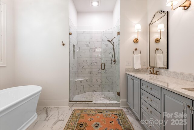20 E Owl Creek Ln, Fairview, NC 28730 - full bath with a shower stall, a freestanding tub, baseboards, double vanity, and marble look tiles