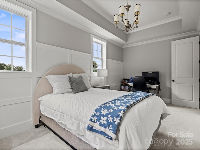 2521 Neely Store Rd, Rock Hill, SC 29730 - bedroom featuring a chandelier, ornamental molding, a tray ceiling, light colored carpet, and a decorative wall