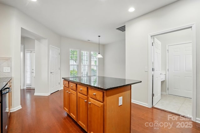 1030 Pinehurst Ln, Fort Mill, SC 29707 - kitchen with dishwashing machine, dark wood-style flooring, recessed lighting, baseboards, and a kitchen island