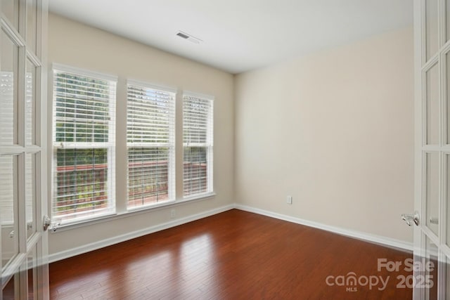 1030 Pinehurst Ln, Fort Mill, SC 29707 - spare room featuring dark wood-type flooring and baseboards