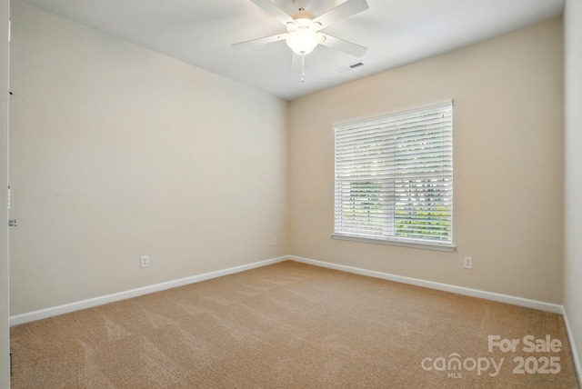 1030 Pinehurst Ln, Fort Mill, SC 29707 - spare room with light colored carpet, baseboards, and ceiling fan