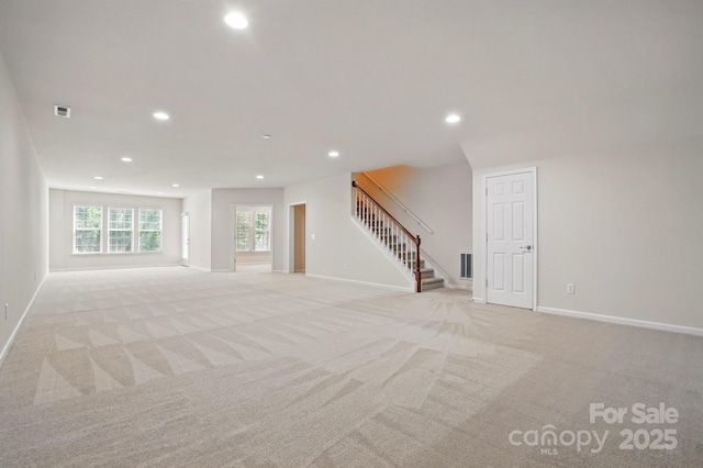 1030 Pinehurst Ln, Fort Mill, SC 29707 - unfurnished living room featuring stairs, recessed lighting, light colored carpet, and baseboards