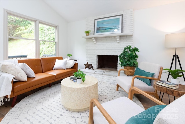 214 Hidden Creek Ln, Burnsville, NC 28714 - living room featuring lofted ceiling and a brick fireplace