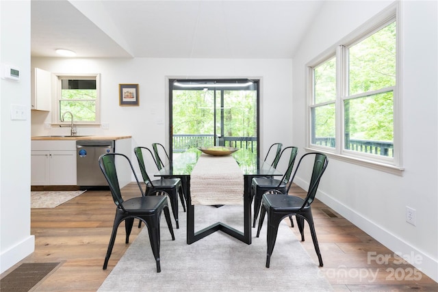 214 Hidden Creek Ln, Burnsville, NC 28714 - dining room featuring light wood-type flooring and baseboards