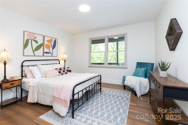 214 Hidden Creek Ln, Burnsville, NC 28714 - bedroom with wood finished floors and baseboards