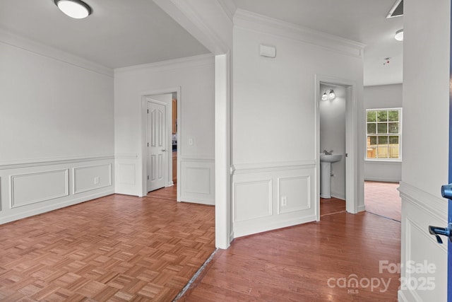 1534 Piney Church Rd, Concord, NC 28025 - spare room with crown molding, a wainscoted wall, parquet flooring, and a sink