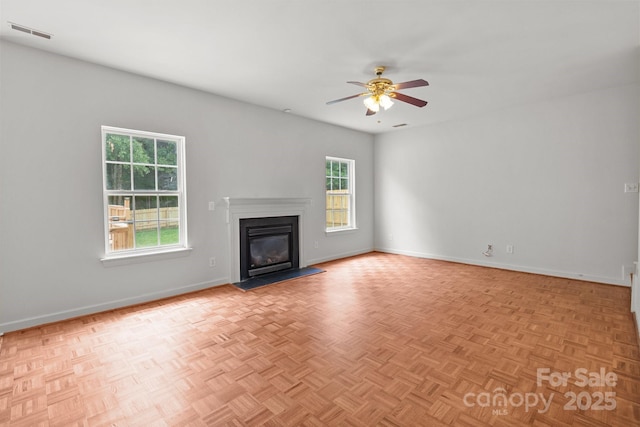 1534 Piney Church Rd, Concord, NC 28025 - unfurnished living room with a glass covered fireplace, ceiling fan, and baseboards