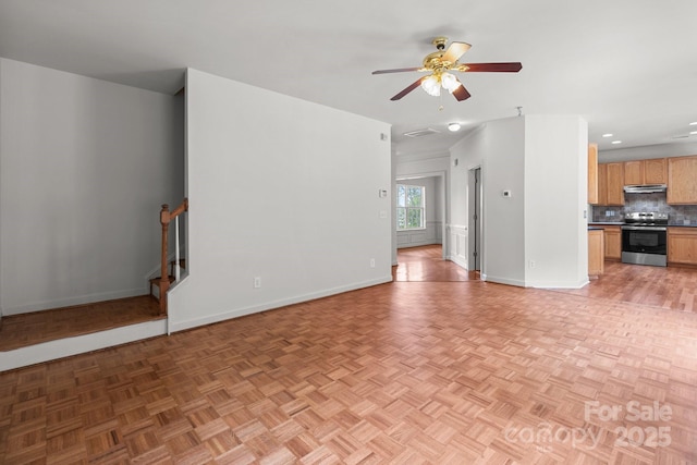 1534 Piney Church Rd, Concord, NC 28025 - unfurnished living room with baseboards, ceiling fan, stairs, and recessed lighting