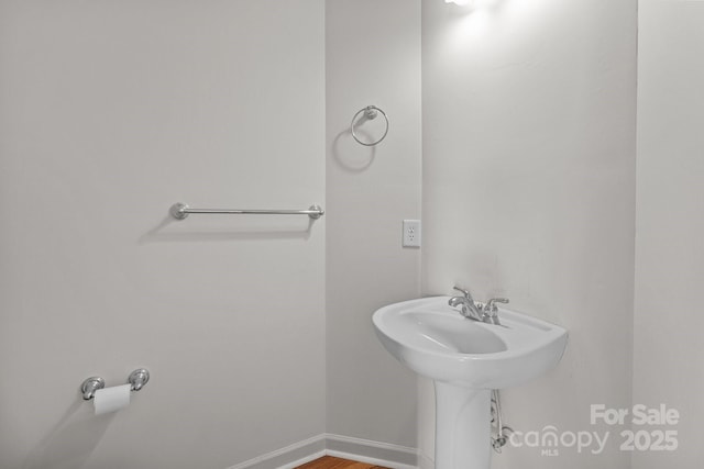1534 Piney Church Rd, Concord, NC 28025 - bathroom with baseboards and wood finished floors
