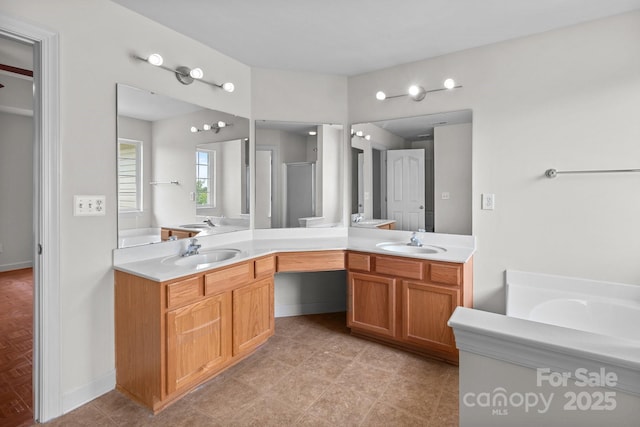 1534 Piney Church Rd, Concord, NC 28025 - bathroom featuring double vanity, a shower stall, a tub, and baseboards