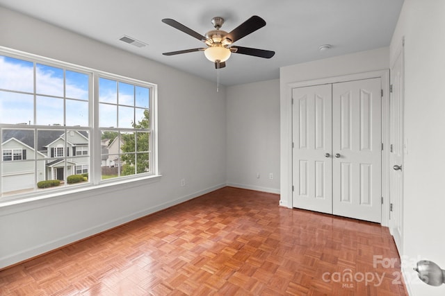 1534 Piney Church Rd, Concord, NC 28025 - unfurnished bedroom with baseboards, a closet, and a ceiling fan