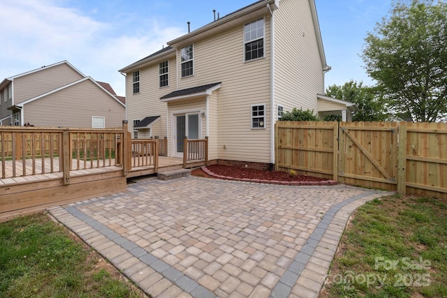 1534 Piney Church Rd, Concord, NC 28025 - rear view of house featuring a patio, a wooden deck, a fenced backyard, and a gate