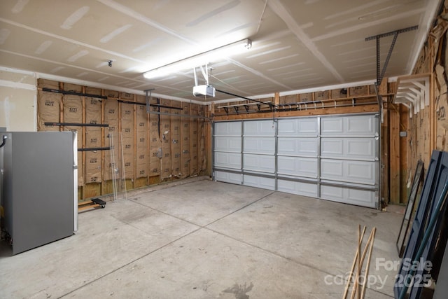 1534 Piney Church Rd, Concord, NC 28025 - garage featuring a garage door opener and freestanding refrigerator