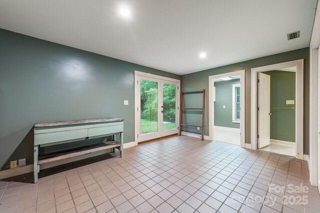 tiled empty room with french doors, recessed lighting, and baseboards