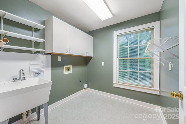 laundry area with cabinet space, hookup for a washing machine, baseboards, and hookup for an electric dryer