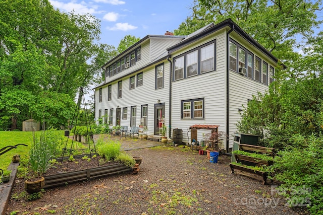 1186 US-70 Hwy, Black Mountain, NC 28711 - back of house with a vegetable garden, a chimney, and a patio