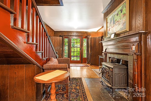 1186 US-70 Hwy, Black Mountain, NC 28711 - entrance foyer with wood walls, stairway, dark wood-type flooring, and a wood stove