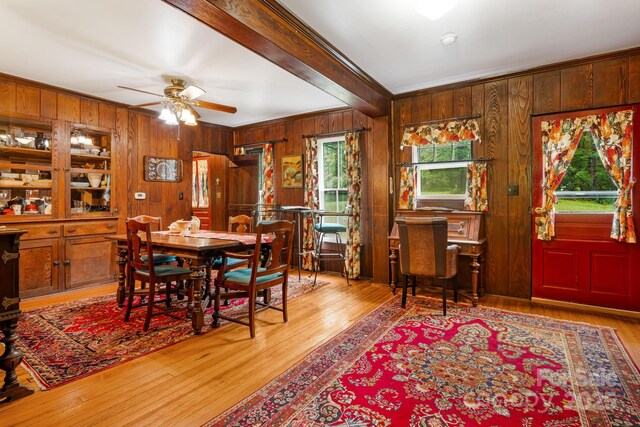 1186 US-70 Hwy, Black Mountain, NC 28711 - dining room featuring wood walls, crown molding, ceiling fan, wood finished floors, and beam ceiling