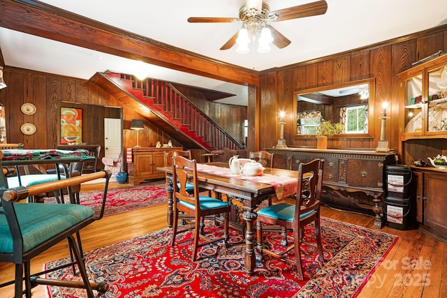 1186 US-70 Hwy, Black Mountain, NC 28711 - dining space with wooden walls, stairs, a ceiling fan, and wood finished floors