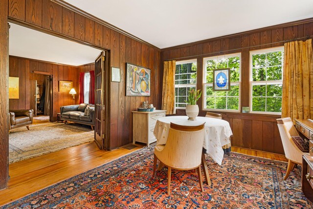1186 US-70 Hwy, Black Mountain, NC 28711 - dining space with wood walls, wood finished floors, and crown molding