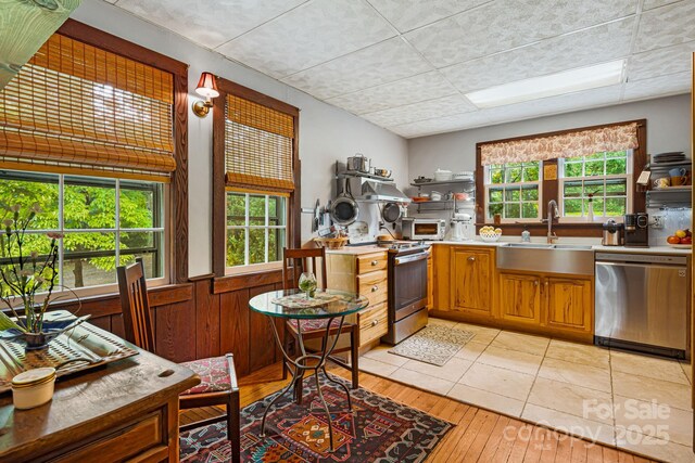 1186 US-70 Hwy, Black Mountain, NC 28711 - kitchen with appliances with stainless steel finishes, a sink, open shelves, wainscoting, and light countertops