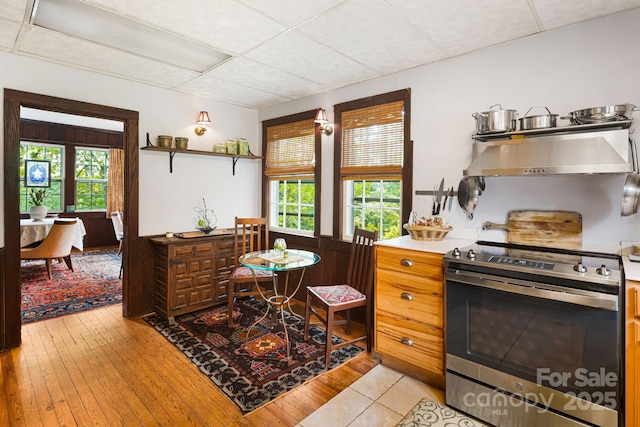1186 US-70 Hwy, Black Mountain, NC 28711 - kitchen featuring stainless steel electric range oven, ventilation hood, open shelves, light countertops, and a paneled ceiling