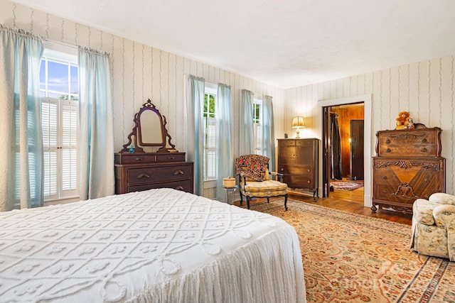 1186 US-70 Hwy, Black Mountain, NC 28711 - bedroom featuring wallpapered walls and wood finished floors