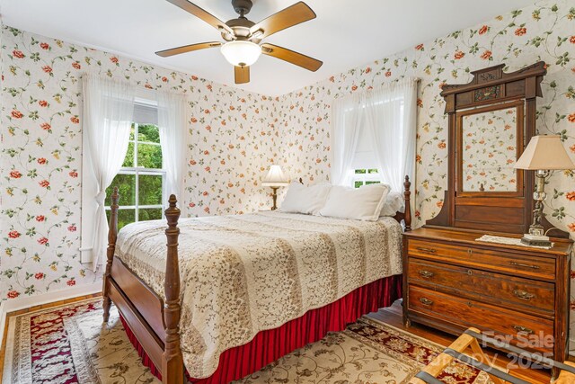1186 US-70 Hwy, Black Mountain, NC 28711 - bedroom with wallpapered walls, baseboards, and ceiling fan