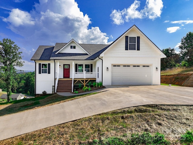 220 Pine Ridge Rd, Mars Hill, NC 28754 - modern farmhouse featuring a porch, concrete driveway, a shingled roof, and board and batten siding