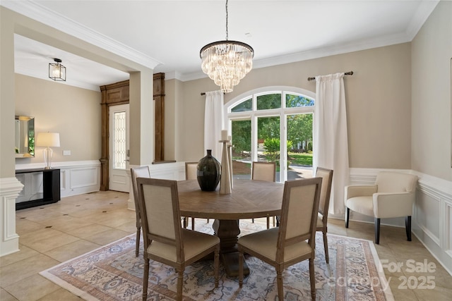 14515 Nolen Ln, Charlotte, NC 28277 - dining space with a decorative wall, a chandelier, ornamental molding, a wainscoted wall, and light tile patterned floors